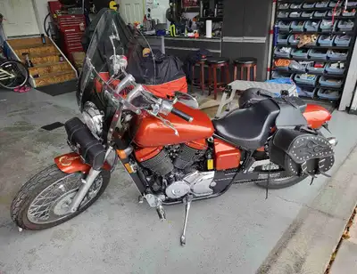 This is a 2006 Honda Shadow VT750DA6, a reliable cruiser with a smooth ride. It's in used condition...