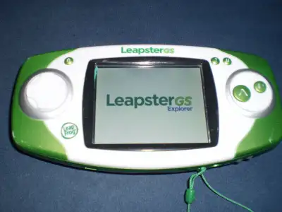 LeapFrog LeapsterGS Explorer with Disney Jake and the Never Land Pirates learning game AND LeapFrog...