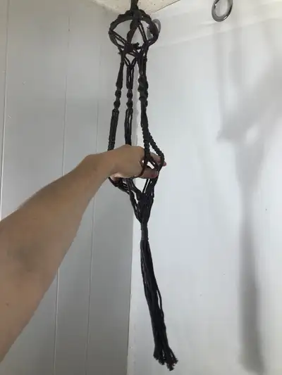 Brown Macrame Plant Hanger. NEW Will hold up to a 6” pot Brand new. 34” long Now $22 Cash or E-trans...