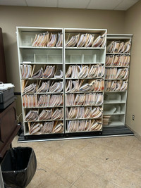 Bi-file lateral sliding file cabinets