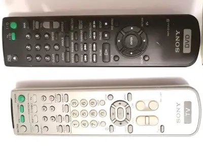 SONY TV/VCR/DVD/SAT/CABLE/VIDEO REMOTES, SILVER ONE IS SONY TV TV/DVD/VCR/SAT/CABLE REMOTE, BLACK ON...