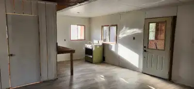 2 bedroom cabin with open concept livingroom and kitchen area. Newer flooring. Septic and dug well a...