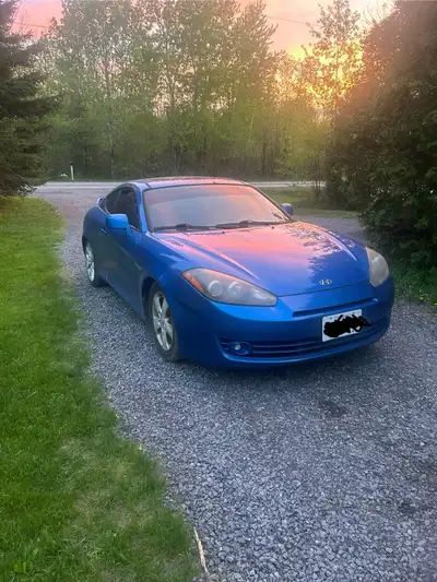 07 Tiburon automatic. Runs and drives great, only has an airbag light. Brand new brakes on the front...