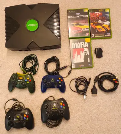 Modified original Xbox console comes with four controllers, power cable, and AV cables. Black consol...