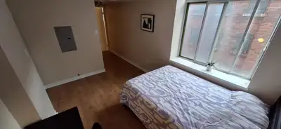 Spacious and comfortable master bedroom located directly across from the iconic Distillery District....