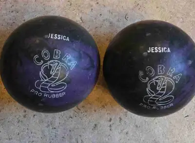 Cobra purple and black bowling balls, 4 3/4" diameter and 3 pounds 6 ounces (smallest of the type)....