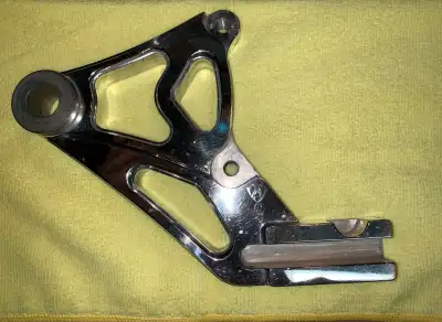 Arlen Ness billet Softail rear brake caliper bracket, right side. Fits 11.5” rotor, 3/4” axle, 3.5”...