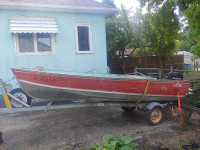 14 1/2 ft Lund with 18hp Mercury motor and Shore landr trailer