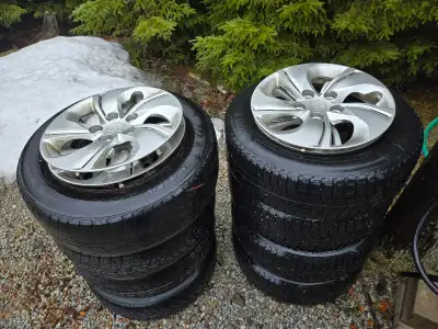 2 sets of 15" steel rims off a 2013 civic. One set of tires are no good the other set still have som...