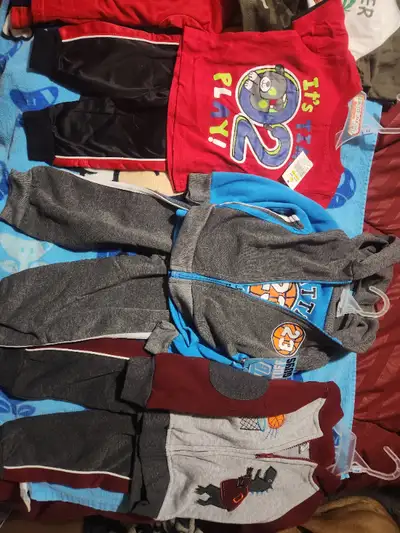Some brand new 12-18months clothes. some toy story outfits and spiderman pjs. Brand name cloths like...