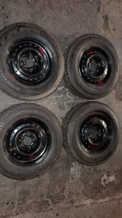 Like new- Firestone winter force 2 set ( 205/70R15 ) on steel rims. used for half a season, almost n...