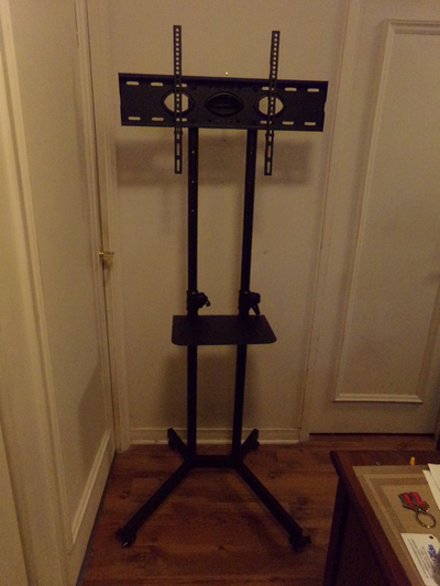 UNIVERSAL PORTABLE MOBILE TV STAND ON WHEELS IN NEW CONDITION, View more