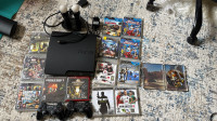 PS3 console with 2 controllers 14 games and Move set 