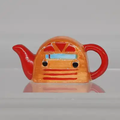 Vintage Red Rose Radio 1920 teapot figurine . Mint condition. Asking $20.00 OBO.