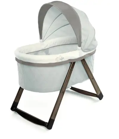 This used Ingenuity Foldaway Rocking Wood Bassinet is the perfect portable bassinet, as it's lightwe...