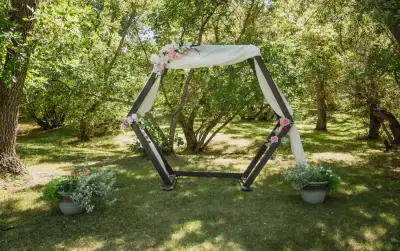 Beautiful coffee brown double hexagon archway for your special occasion! About 84” high.