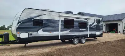 loaded model 36' Springdale travel trailer with appliances, 1 slide out, outside light and stabilizi...