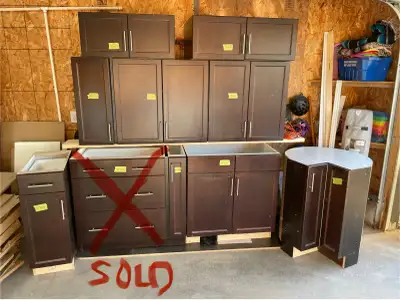 Various base & upper Espresso color kitchen cabinets, still in good shape with a little water staini...