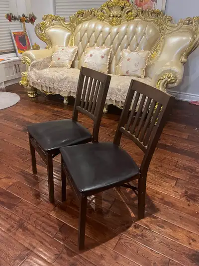Two wooden chairs, View more