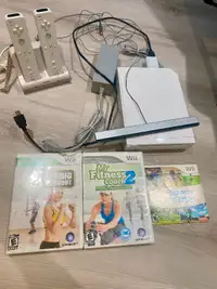 Wii console with remotes and games