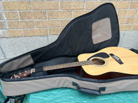 Guitar Acoustic  Yamaha F310 with soft case / three books / one 