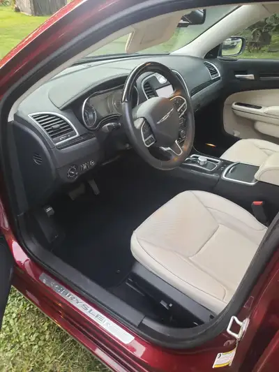 red pearl paint, rain sensing windshield , light package , 8894 miles, never driven in winter , prem...