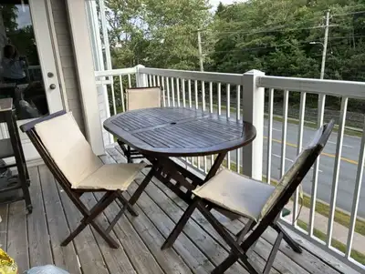 Teak patio table and 4 matchingchairs, View more