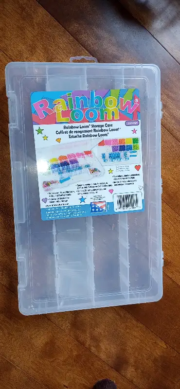 Rainbow loom storage box for elastics and supplies. Comes with plastic dividers.