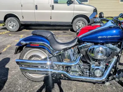 Complete factory exhaust softail deuce. one small dent