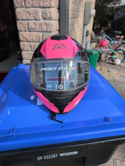 This is a PRO-MAX pink and black helmet in XS size. It is in brand new condition. Please see the ima...