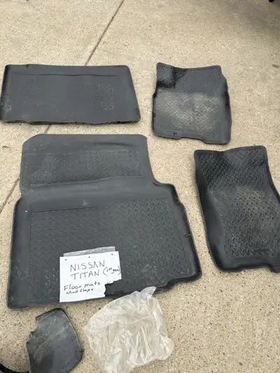 Sets of floor mats for 1st generation Nissan Titan. Free for pick up. Two mud flaps for same vehicle...