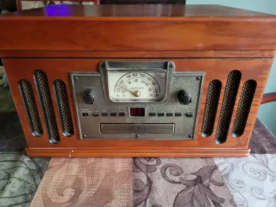 Vintage-looking record player, cassette tape player and radio, View more