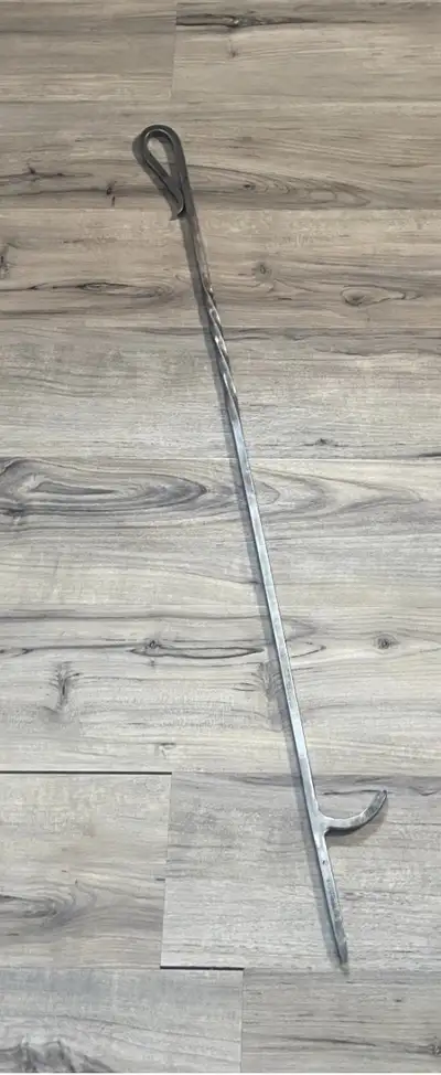 This Blacksmith hand forged fire poker is perfect for an outdoor camp fire or an indoor fire place....