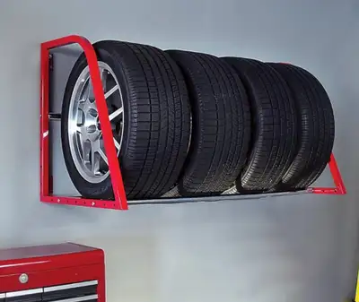 Like new garage tire storage rack. Holds max weight. Comes with all installation parts. Like new!! R...