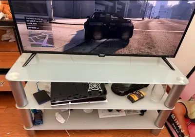 Light blue tint glass tv stand, View more