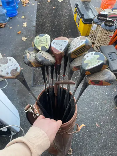 Step back in time with this collection of vintage golf clubs, each with its unique character and sto...