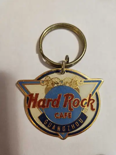 Add a piece of rock 'n' roll history to your collection with this used like new Hard Rock Cafe Guang...