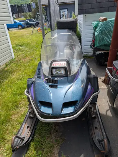 Yamaha enticer 2. Runs good. Hood cracked