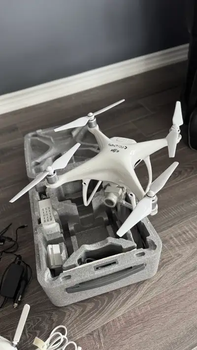 Up for sale is my DJI Phantom 4 drone, an excellent choice for aerial photography and videography en...