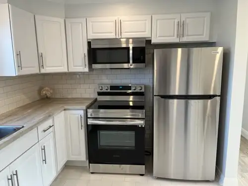 Renovated, freshly painted, bright two-bedroom, 2nd level apartment, in 3-unit building backing onto...