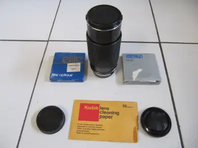 Up for sale is an RMC Tokina 80-200mm 1:4 SLR Zoom Lens and five piece accessory lot which includes:...