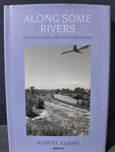 First edition, New, Hardcover copy of: "Along Some Rivers: Photographs and Conversations" by Robert...