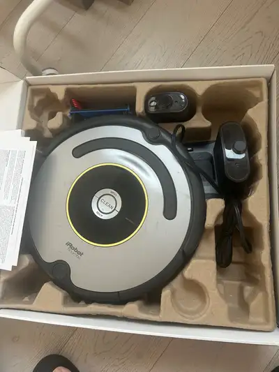 This iRobot Roomba 600 Series vacuum cleaning robot is in good, used condition and ready to keep you...