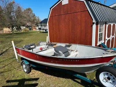 14 ft Alumacraft fishing boat with trailer. New lights and tires on trailer with new bearing buddies...