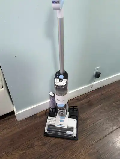 Clean your floors effortlessly with this Shark Cordless HydroVac, a 3-in-1 cordless vacuum, mop, and...