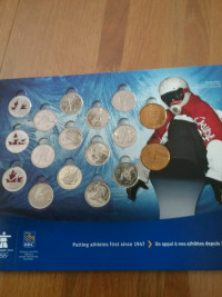 Complete  2010  Olympic albums, coins are from unopen rolls.