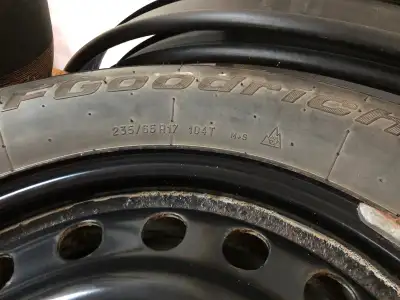 Low Kms BFGoodrich Winter Slaloms. Size 235/65/17 Mounted And Balanced On Black Steel Wheels. No Hol...