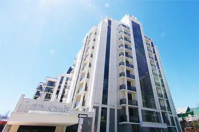 A premium master bedroom in a modern 2-bedroom unit at City Square Condominium (85 Robinson St.) is...