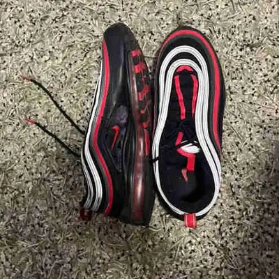 Selling a pair of used Nike Air Max 97 shoes, sized US 11, featuring a sleek black, red, and white c...