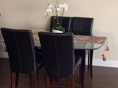 Dining Table with heavy beveled edge glass top and espresso wood base. Excellent condition. No scrat...